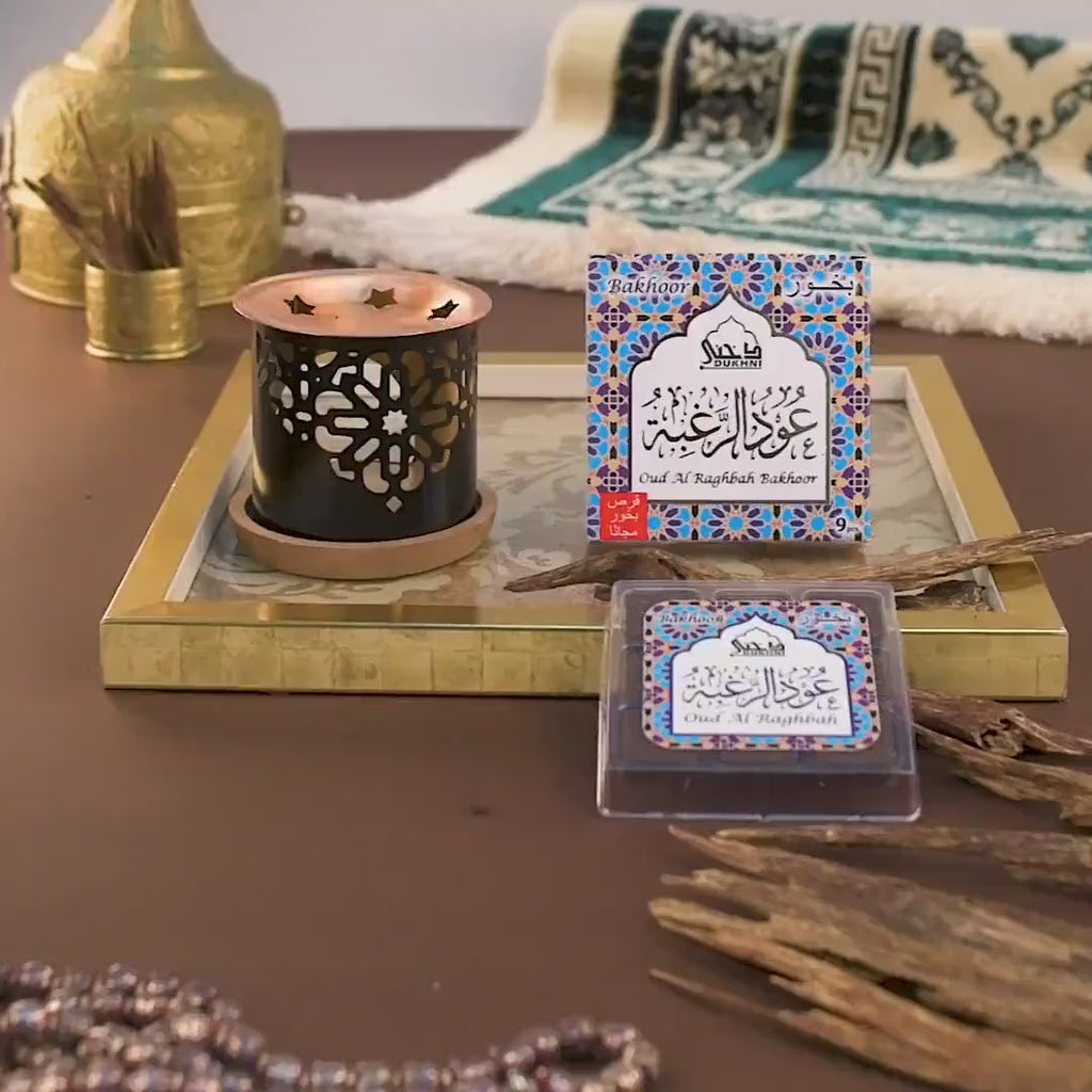 Dukhni Oud Al Raghbah Bakhoor with a smokeless handmade candle burner, featuring authentic oud for a rich aromatic experience, available in the UK.